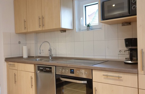 Nordseebad Burhave Apartamento | Vacation apartment Meermuschel in Burhave for 2-4 pers. with garden and barbecue by the sea
