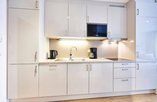 Bensersiel Apartamento | Vacation apartment near the beach with terrace incl. free use of swimming pool & sauna