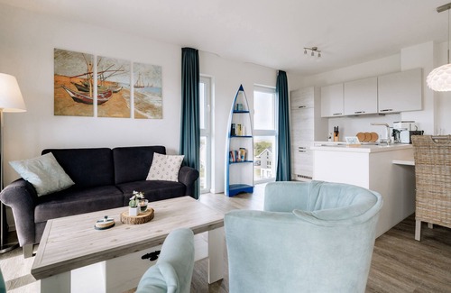 Schillig Apartamento | Vacation apartment with a view of the sea and meadows, sauna & electric fireplace for relax