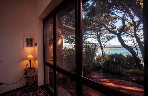Porto Pino Villa | Casa de vacaciones 'Fronte Mare Al Porticciolo' con vistas al mar, zona de barbacoa y Wi-Fi