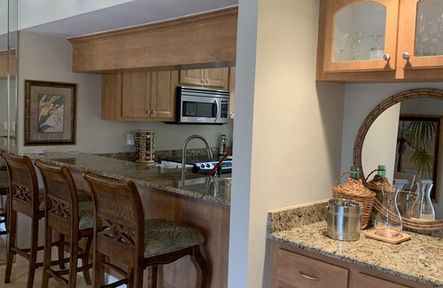 Biggar Condominio | Vacation in the Forest CC heated pool view of golf course near beaches airport