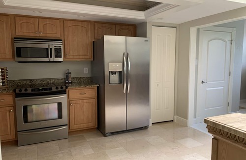 Biggar Condominio | Vacation in the Forest CC heated pool view of golf course near beaches airport
