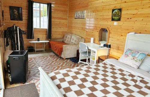 Ahascragh Otro | Valley view cabin in the woods on a farm