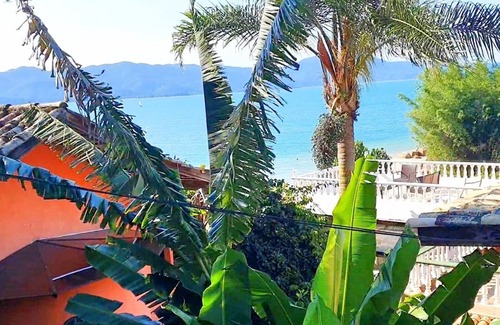 Florianopolis Cabaña | Veranda - Charming 3-bedroom Cottage with AC in Peacefull Daniela Florianopolis
