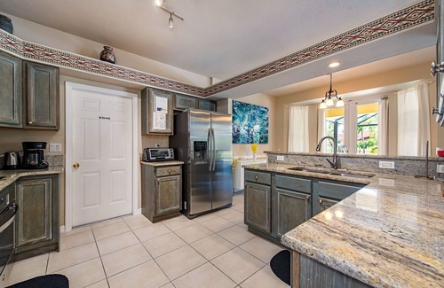 Palm River Estates Casa | Vibrant home close to best beach parks and shops backyard pool with a lake