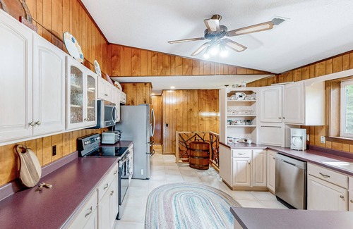 Franklin Casa | View-worthy home lined by trees with a fireplace, wrap-around deck, grill, & W/D