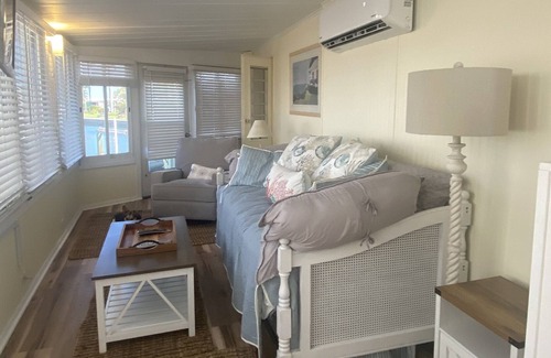 Nettles Island Cabaña | Vintage cozy beach house waterfront on grand canal with dock