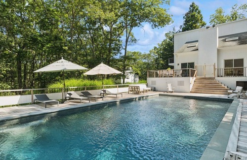 East Hampton Casa | Wainscott retreat w resort-style indoor-outdoor living, pool, total.