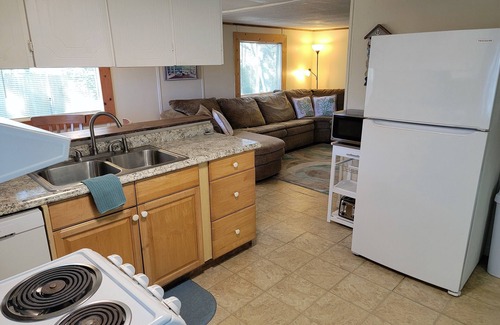 Butler Beach Cabaña | Wake up to an amazing sunrise from your wood deck with outdoor furniture