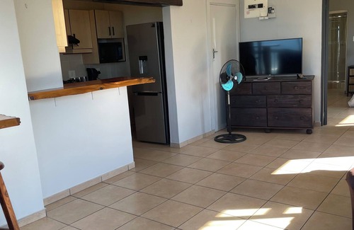 Warner Beach Cabaña | Wake up to gorgeous sunrises and sea views upon a wooden balcony.