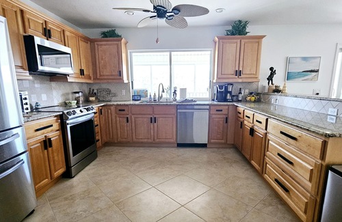 Laguna Shores Casa | WALK TO BEACH, PRIVATE FAMILY AND PET FRIENDLY POOL HOME ON A CANAL