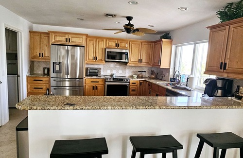 Laguna Shores Casa | WALK TO BEACH, PRIVATE FAMILY AND PET FRIENDLY POOL HOME ON A CANAL