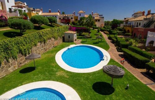 Costa Esuri Casa | (WAR002) Town House with Garden and Pool Access