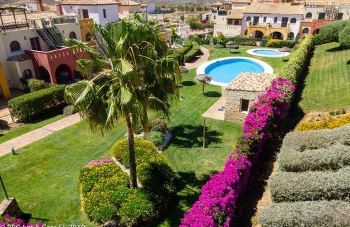 Costa Esuri Casa | (WAR002) Town House with Garden and Pool Access