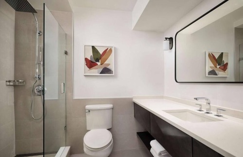 White Plains Hotel | Warm and Comfortable Pets Allowed Two Queen Room w/ Pool and Airport Shuttle
