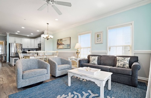 Waters Edge Casa | Water's Edge 114 - River Daze - Premier Riverfront Townhome - Pool & Fishing Pier!