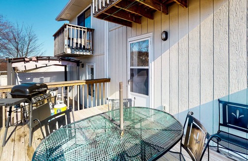 Holiday Island Casa | Water view townhouse with a washer/dryer, central AC, yard & grill