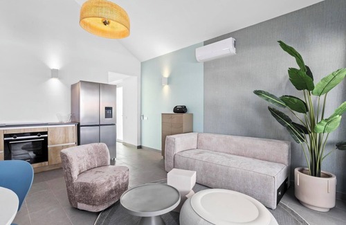 Tera Kora Casa | Water villa with terrace, SUP boards, barbecue, and access to a shared swimming pool.