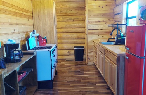 Grove Cabina | Waterfall View Cabin at White Buffalo Lodge; Family-friendly with lake access