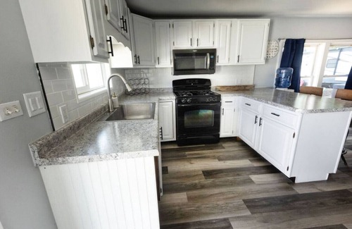 Spring Grove Cabaña | Waterfront 2BR Nautical Cottage on Grass Lake - Hot Tub, Firepit & Year-Round Fun