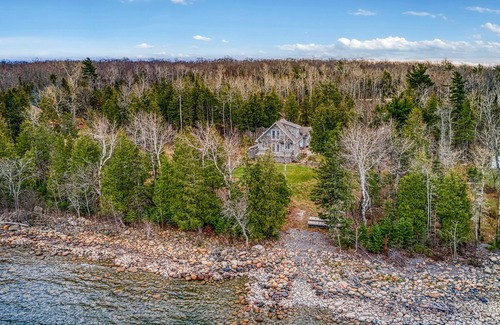 Manitoulin District Casa | Waterfront, chalet style home; minutes walk to the beach