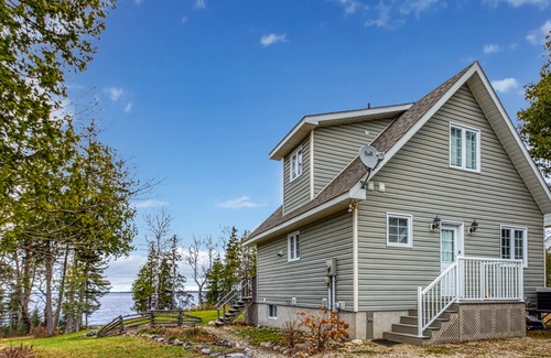 Manitoulin District Casa | Waterfront, chalet style home; minutes walk to the beach