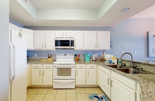 Orange Beach Condominio | ¡NUEVO LISTADO! Condominio frente al mar con piscina compartida, tenis y sauna - cerca de la playa