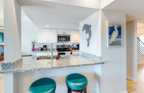 Harbor Oaks Casa | Waterfront condo with balcony, private boat slip, fishing pier, pools, & tennis