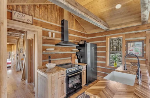Nunnelly Cabina | Waterfront Designer Cabin w/ Dock, Decks, Hot tub and Fire Pits.
