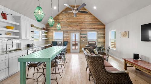 Flour Bluff Casa | Waterfront Escape w Views Shared Pool Boat Dock Orange Crush by AvantStay