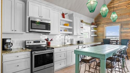Flour Bluff Casa | Waterfront Escape w Views Shared Pool Boat Dock Orange Crush by AvantStay