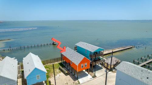 Flour Bluff Casa | Waterfront Escape w Views Shared Pool Boat Dock Orange Crush by AvantStay