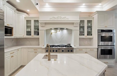 Eastern Shores Casa | Waterfront gated pool mansion.