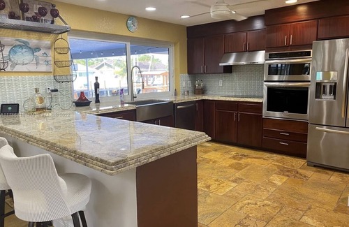 Garden Isles Casa | Waterfront, heated Pool enclosed, our home is completely renovated, very private