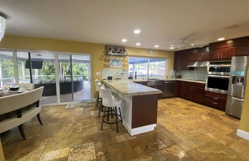 Garden Isles Casa | Waterfront, heated Pool enclosed, our home is completely renovated, very private