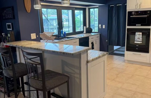 Palm Harbor Casa | Waterfront Lake Tarpon Home with heated salt water pool, fitness room, WiFi