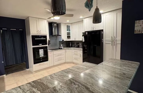 Palm Harbor Casa | Waterfront Lake Tarpon Home with heated salt water pool, fitness room, WiFi