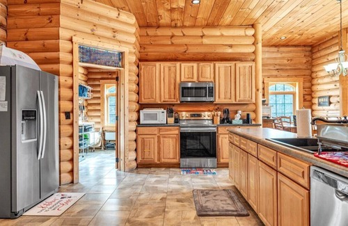 High Point Casa | Waterfront Log Home, Fire Pit & Table, Swim Spa, & Game Room