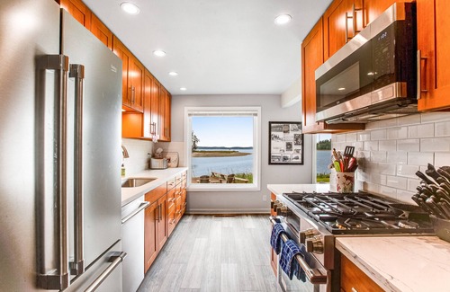Lakebay Casa | Waterfront retreat with private beach, cookhouse, hot tub, EV charger, & firepit