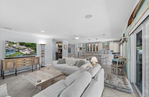 Palm Harbor Casa | Waterfront Retreat with Pool Tiki Bar & Boat Dock
