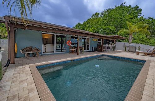 Palm Harbor Casa | Waterfront Retreat with Pool Tiki Bar & Boat Dock