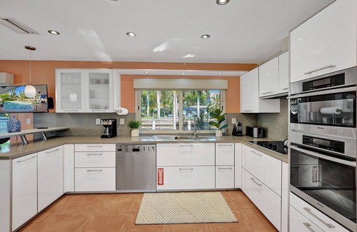 Coral Ridge Isles Casa | Waterfront Serenity. Pool & BBQ. Koi Pond