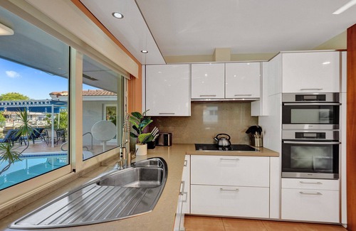 Coral Ridge Isles Casa | Waterfront Serenity. Pool & BBQ. Koi Pond