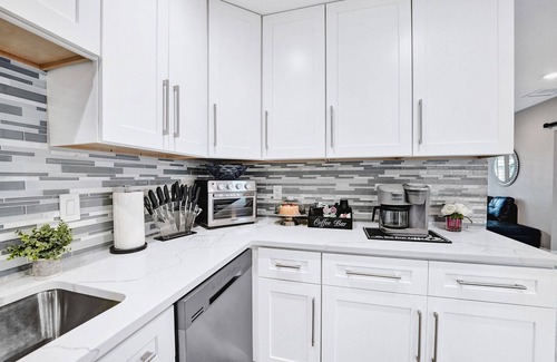 Golfview Harbor Casa | Waterfront Tropic Oasis: Heated Pool, Pergola, Canal, Dock, Air Hockey!