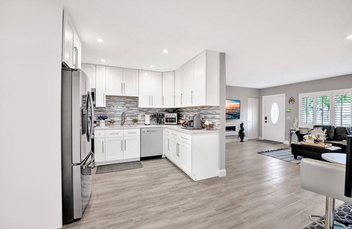 Golfview Harbor Casa | Waterfront Tropic Oasis: Heated Pool, Pergola, Canal, Dock, Air Hockey!