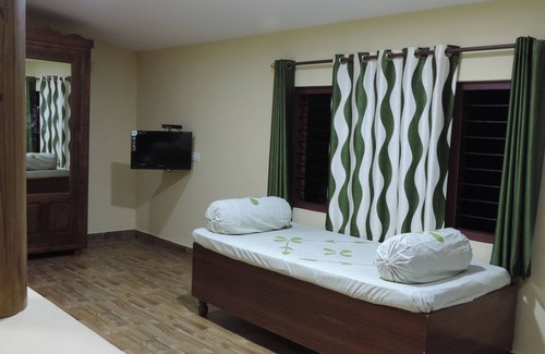 Kolagappara Cama Y Desayuno | Wayanad Stay es un hogar familiar.
