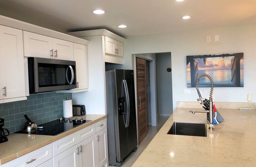 Estate Golden Rock Condominio | WE SHELL SEA - 2 bed / 2 bath beachfront condo- beach and pool.
