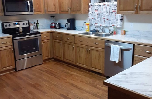 Madison Heights Casa | Welcome Home! New luxurious home awaits - large family room w/ fireplace.