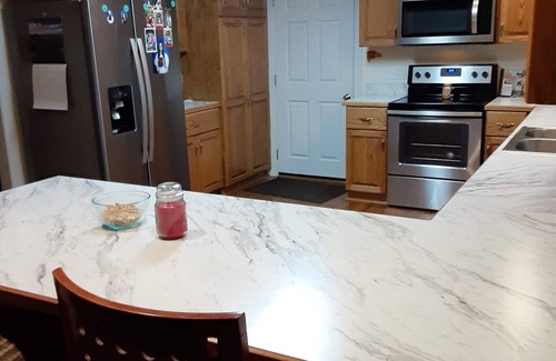 Madison Heights Casa | Welcome Home! New luxurious home awaits - large family room w/ fireplace.