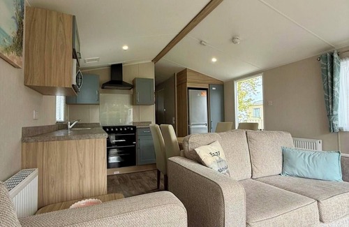 Cross Inn Casa | Welcoming family caravan on large pitch near beautiful New Quay in West Wales